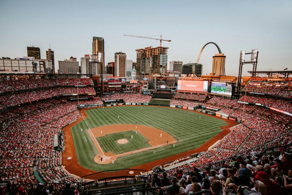 A crowded baseball stadium full with excited people.